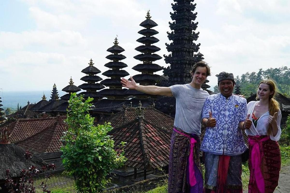 a group of people standing in front of a pagoda