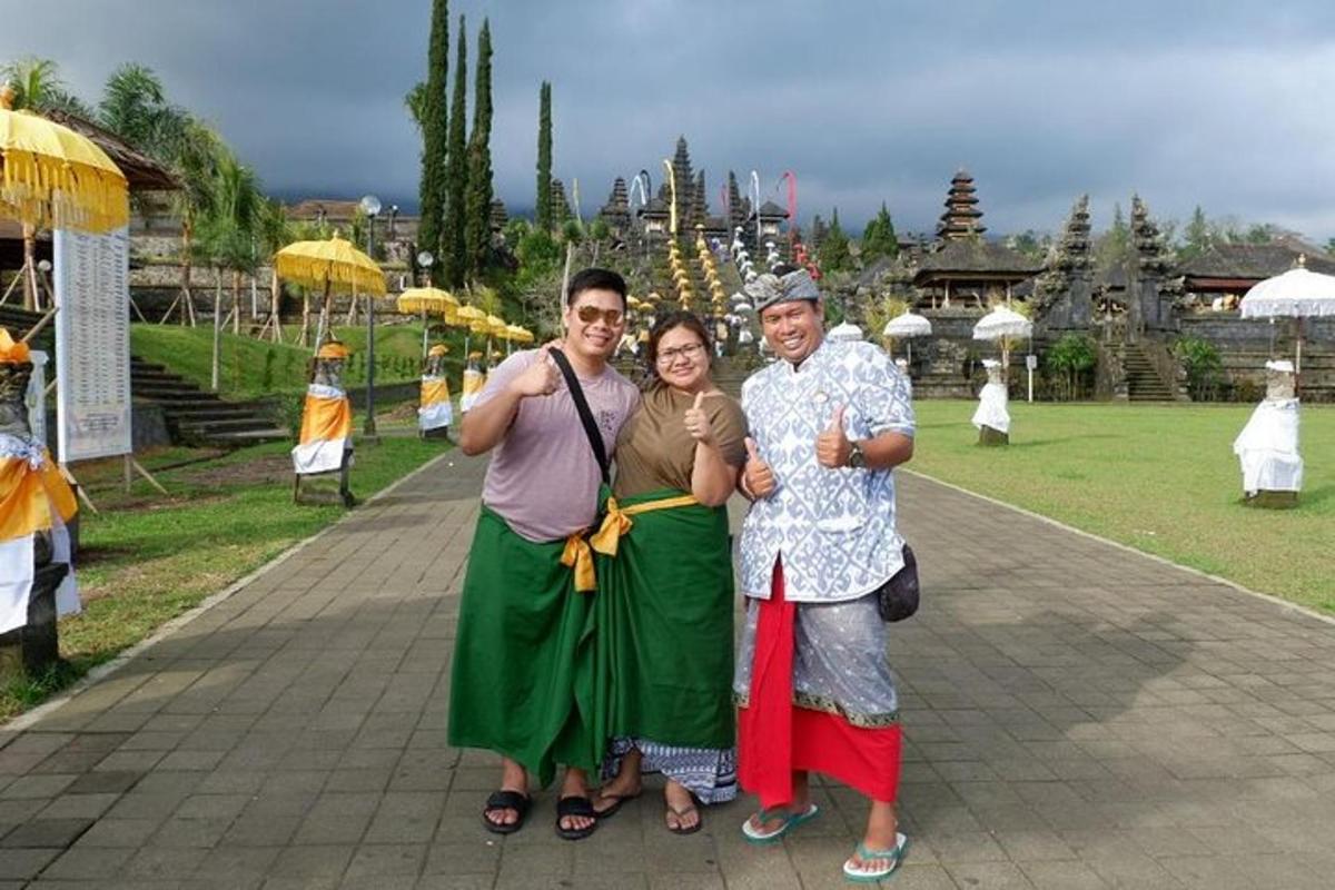 a group of three people posing for a picture
