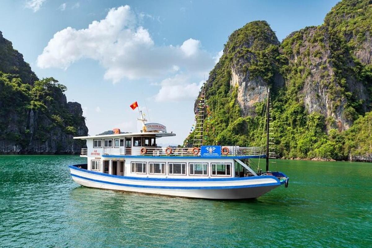a boat in the water with mountains in the background