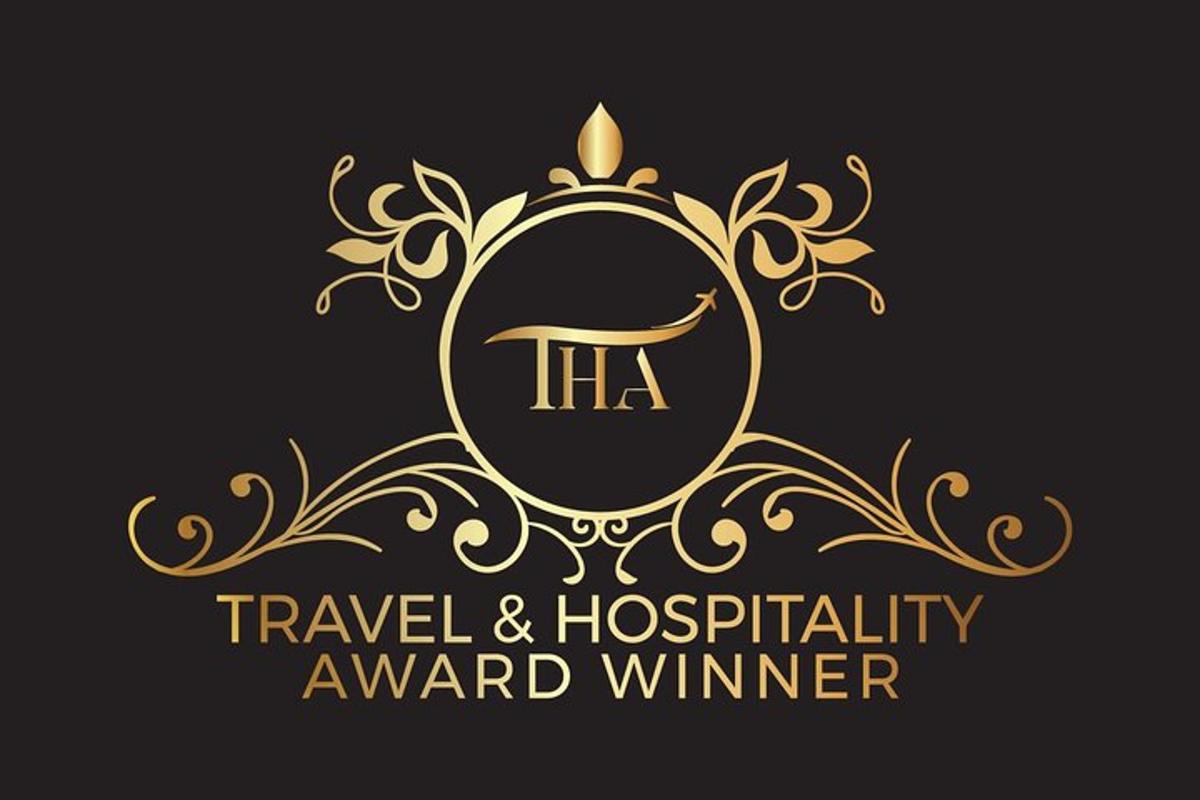a gold logo for a travel and hospitality award winner