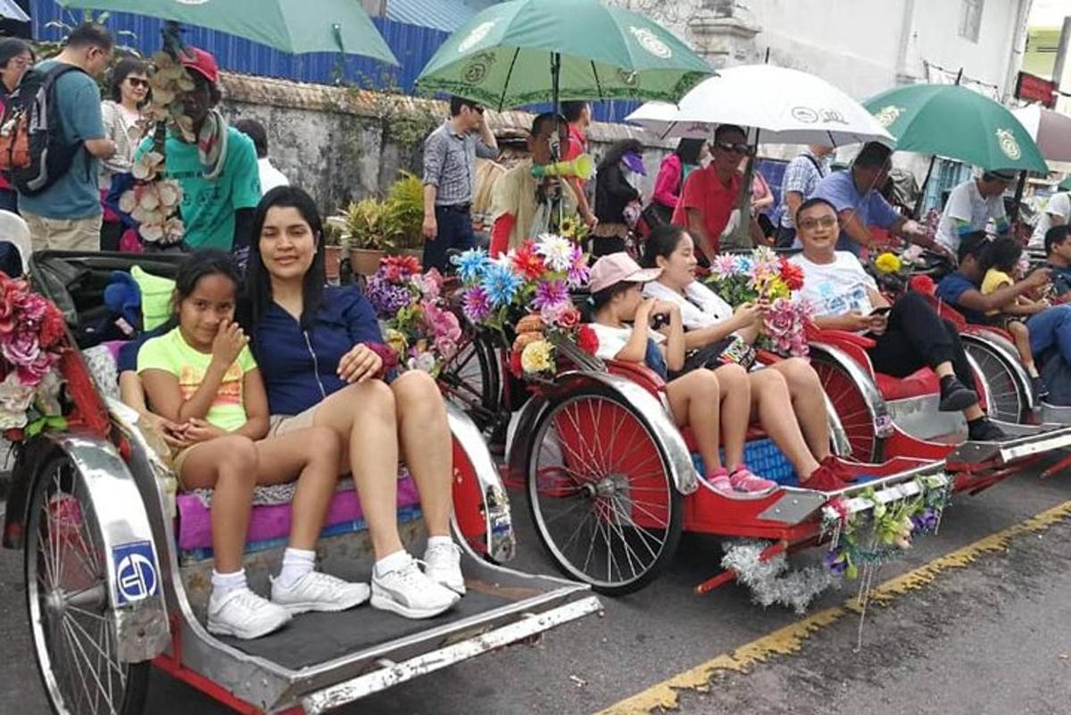 a group of children sitting on the back of a horse drawn carriage