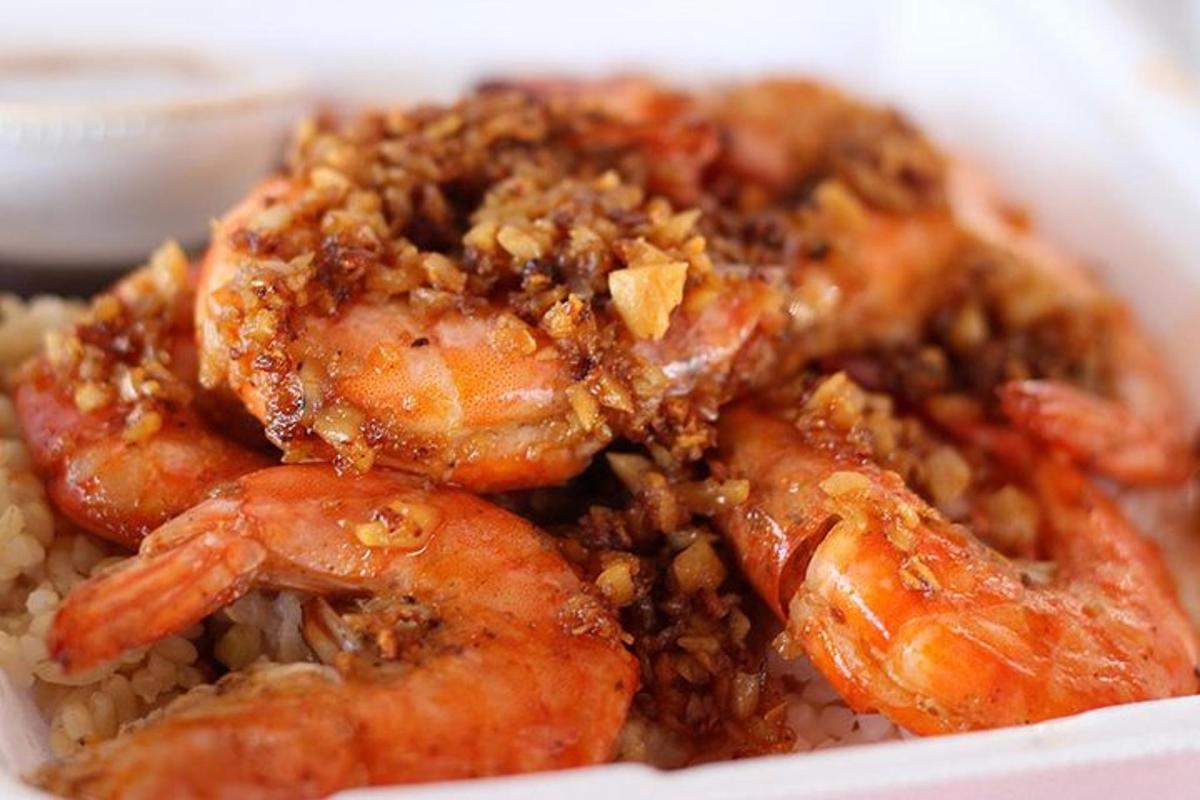 a bowl of shrimp and rice on a plate