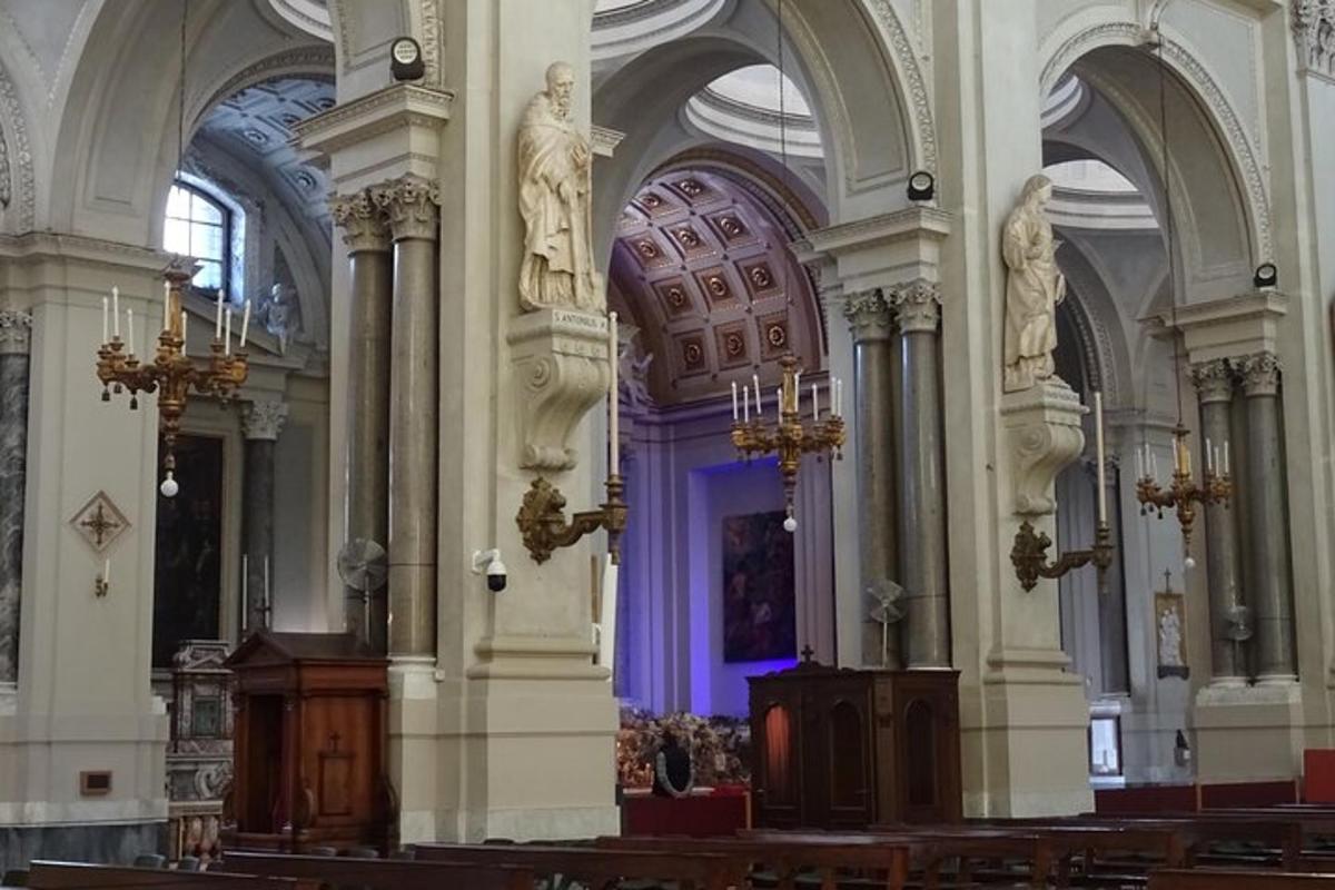 a large church with pillars and ceilings and a purple light