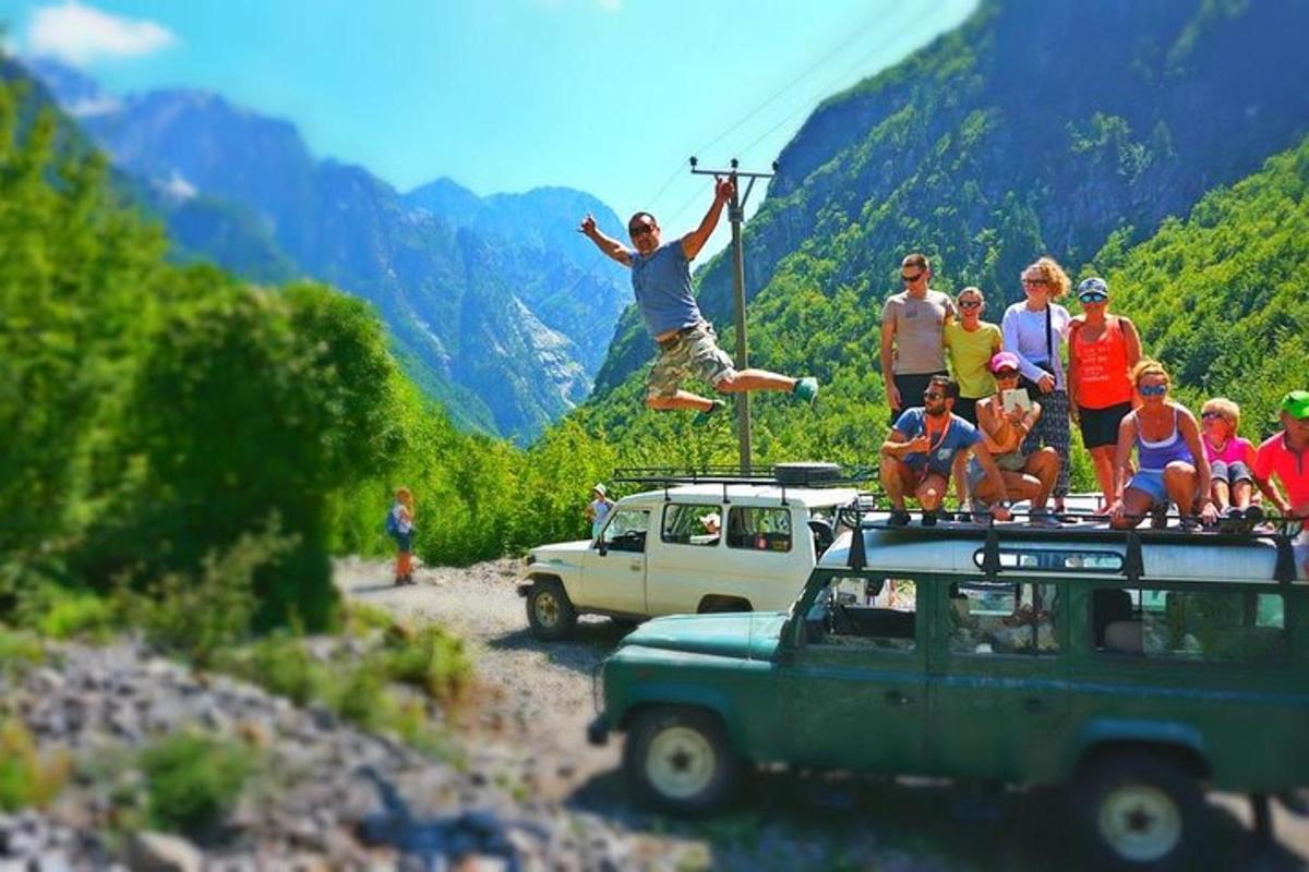 a group of people standing on the top of a car