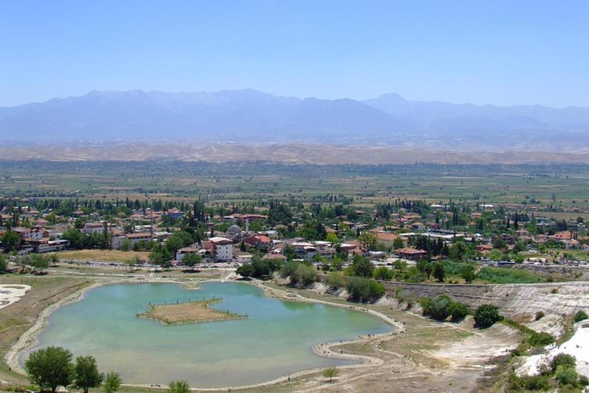 an aerial view of a town and a lake