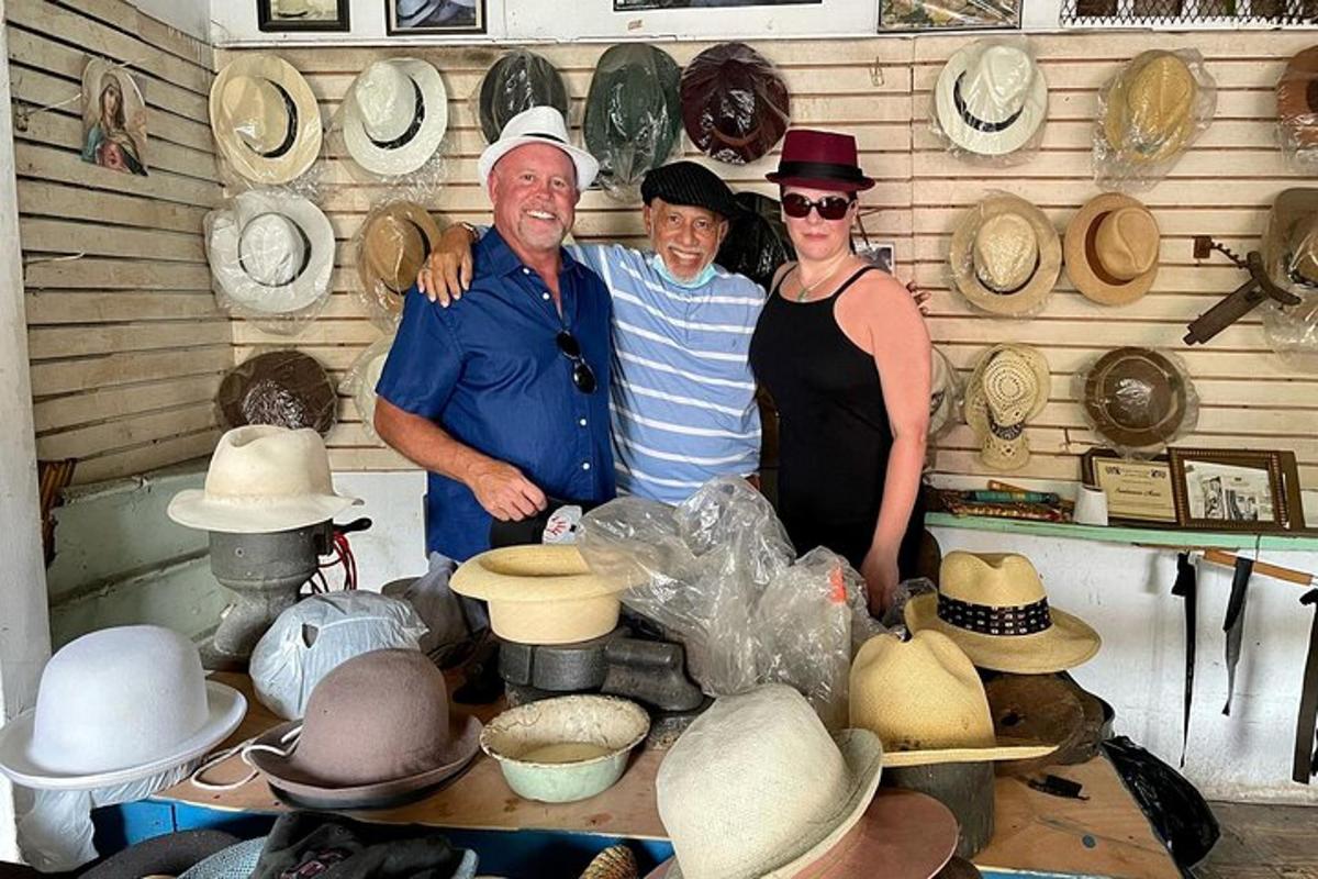 a group of three people posing for a picture with hats