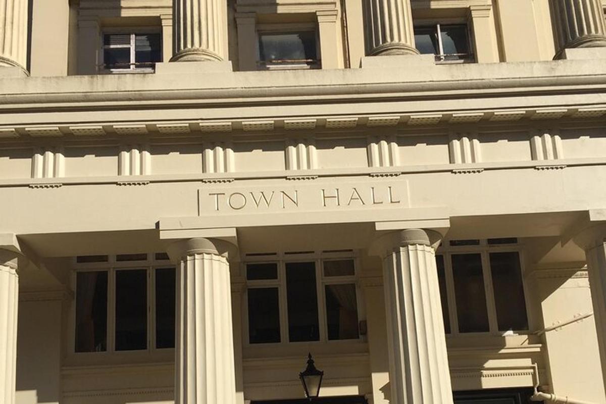 a front of a building with the words town hall