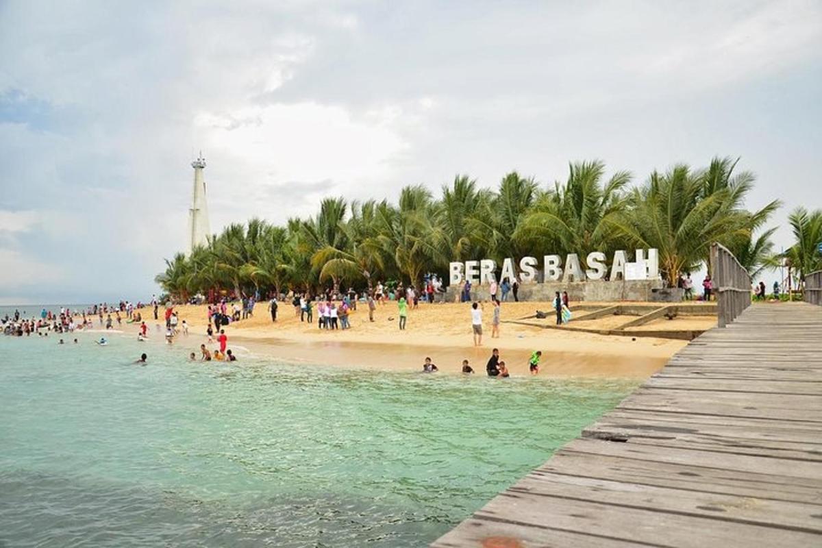 a group of people on a beach near a pier