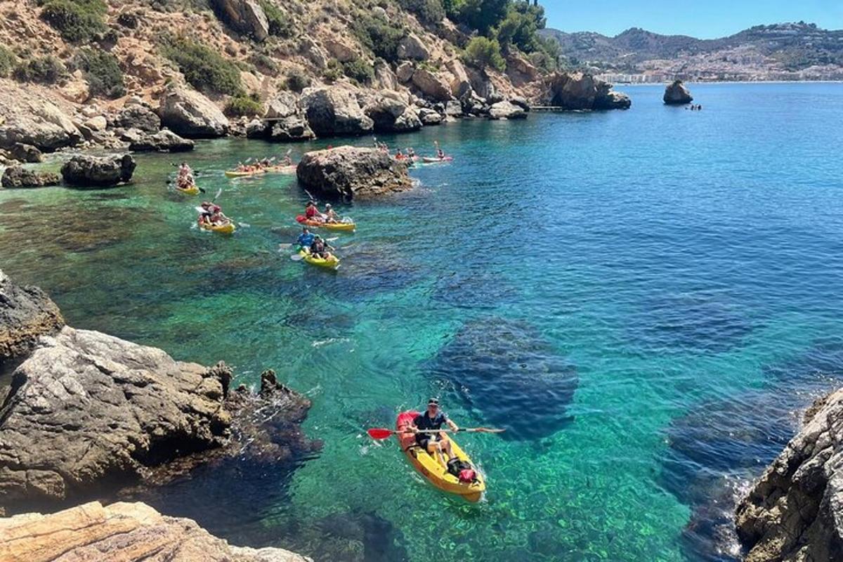 a group of people in kayaks in a body of water