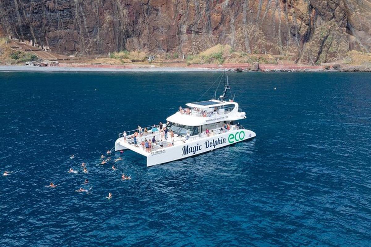 a group of people on a boat in the water