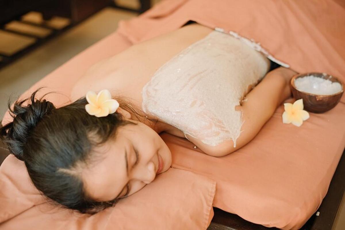 a little girl is sleeping on a bed