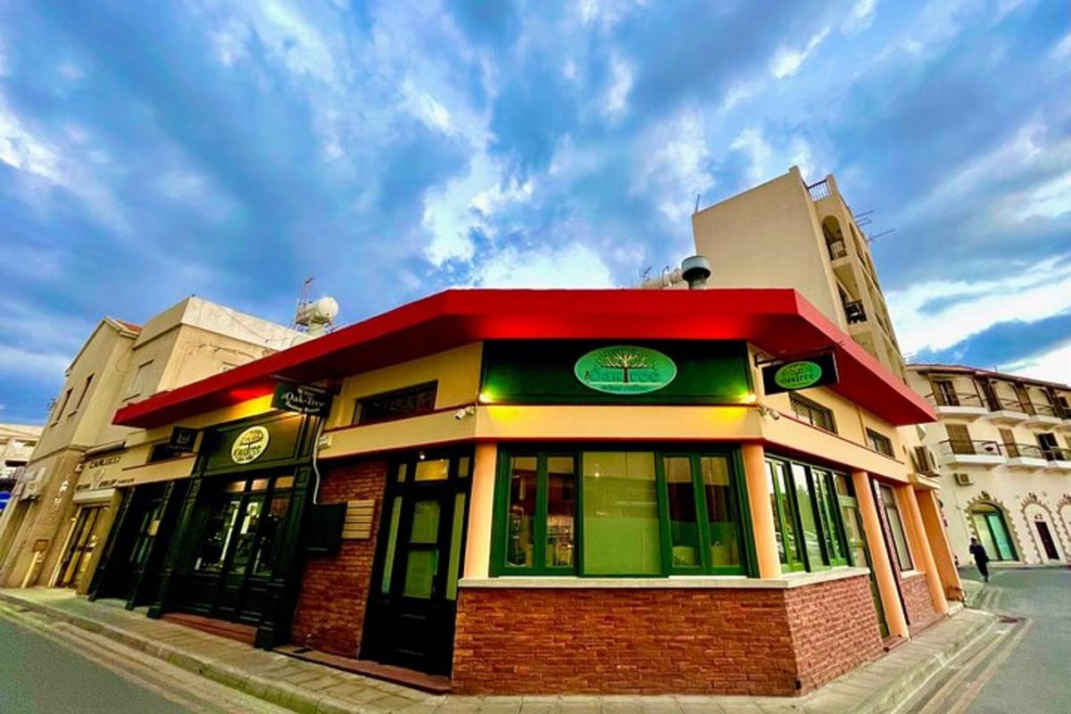 a building on a city street with a cloudy