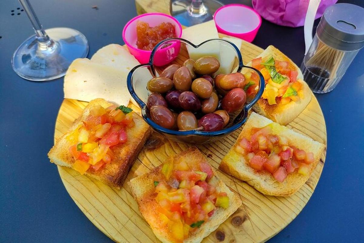 a plate of toast with grapes and a bowl of fruit