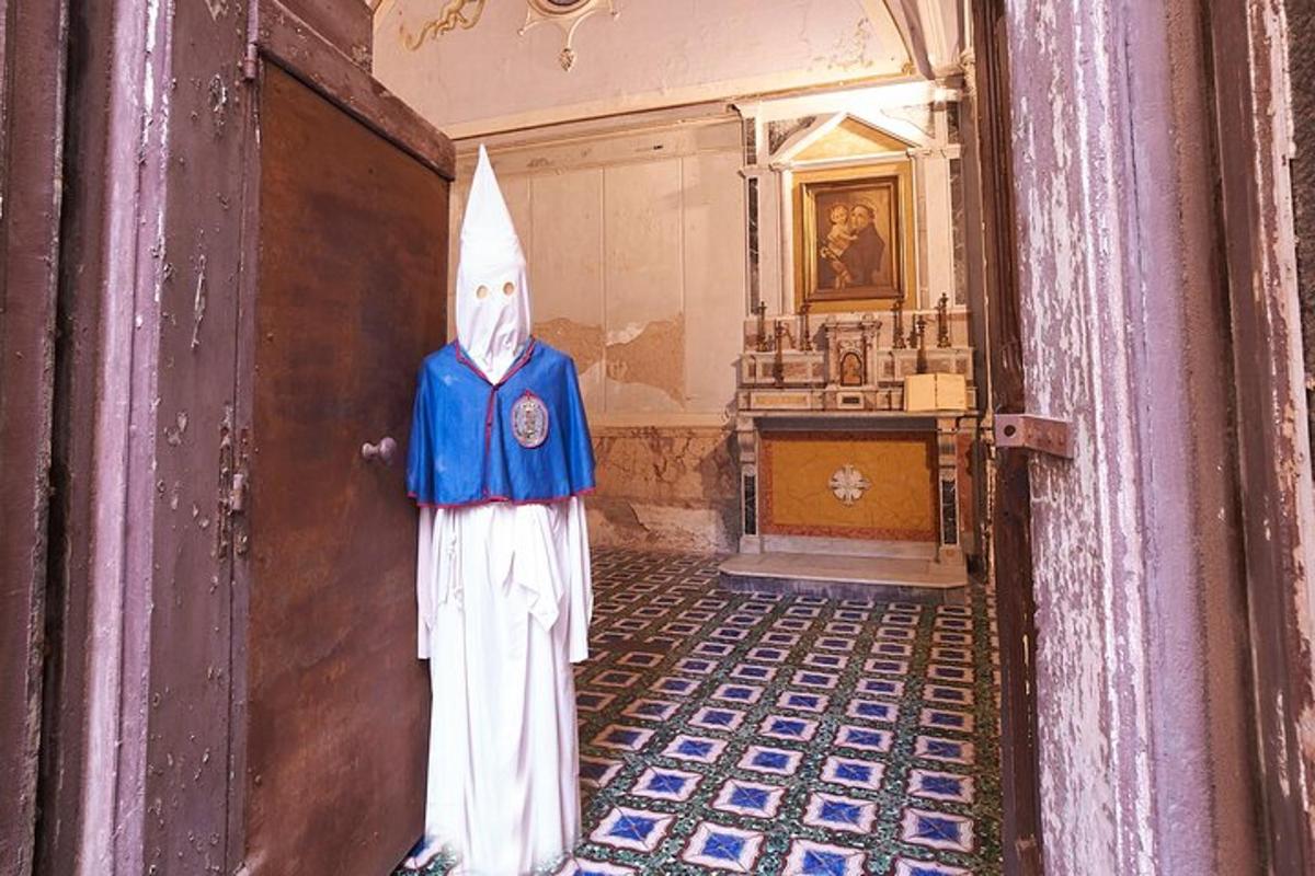a statue of a person in a hallway