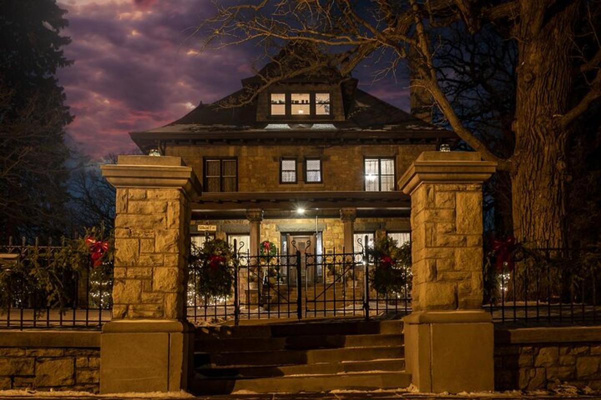 a house with a gate in front of it at night