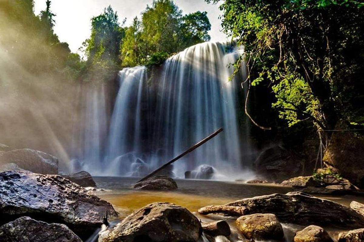 a waterfall in the middle of a river