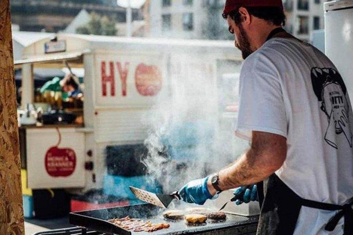 a man is cooking food on a grill
