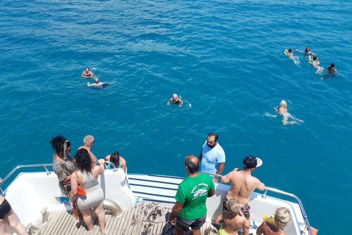 a group of people on a boat in the water
