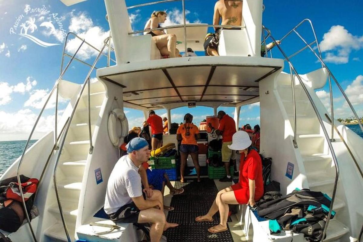 a group of people sitting on the back of a boat
