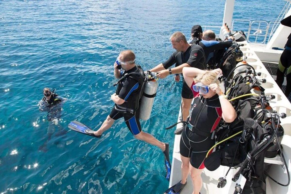 a group of people on a boat in the water