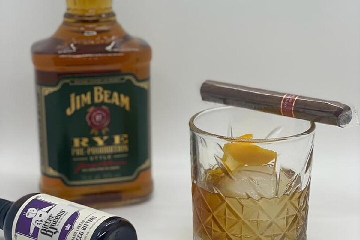 a bottle of jim beam rye whiskey next to a glass