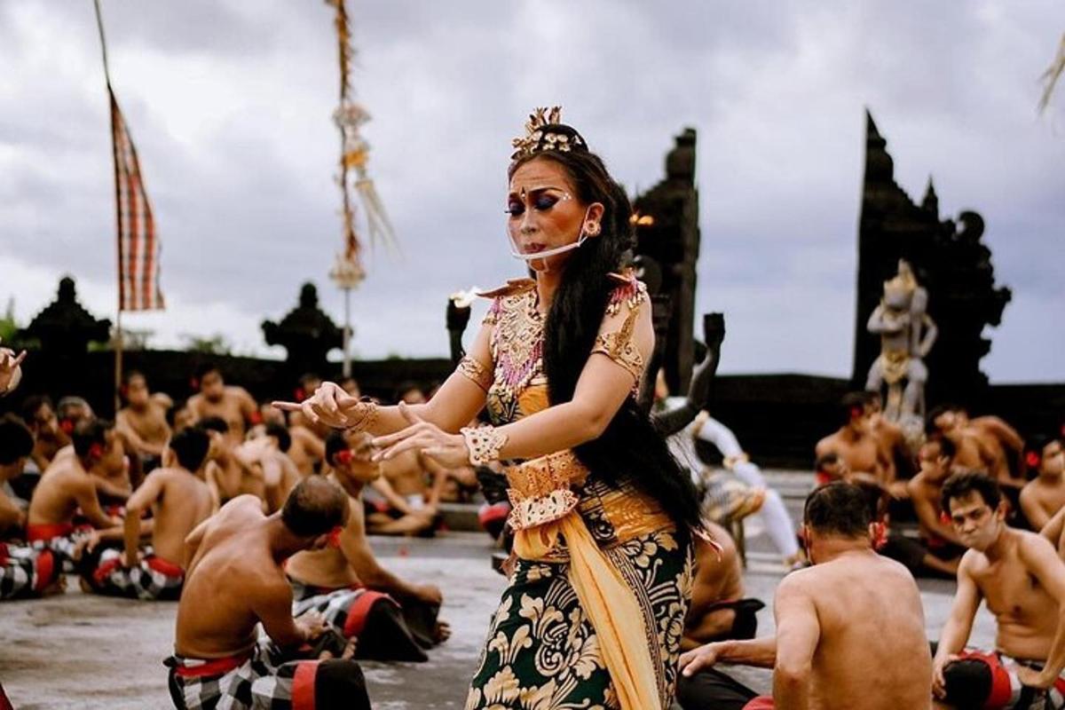 a woman performing a ritual in front of a crowd of people