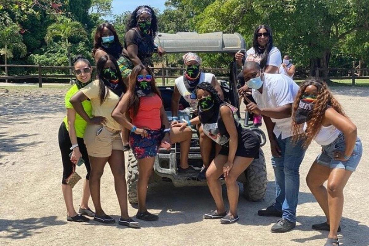 a group of people standing next to a truck