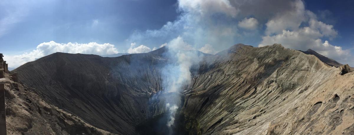 a mountain with smoke coming out of it