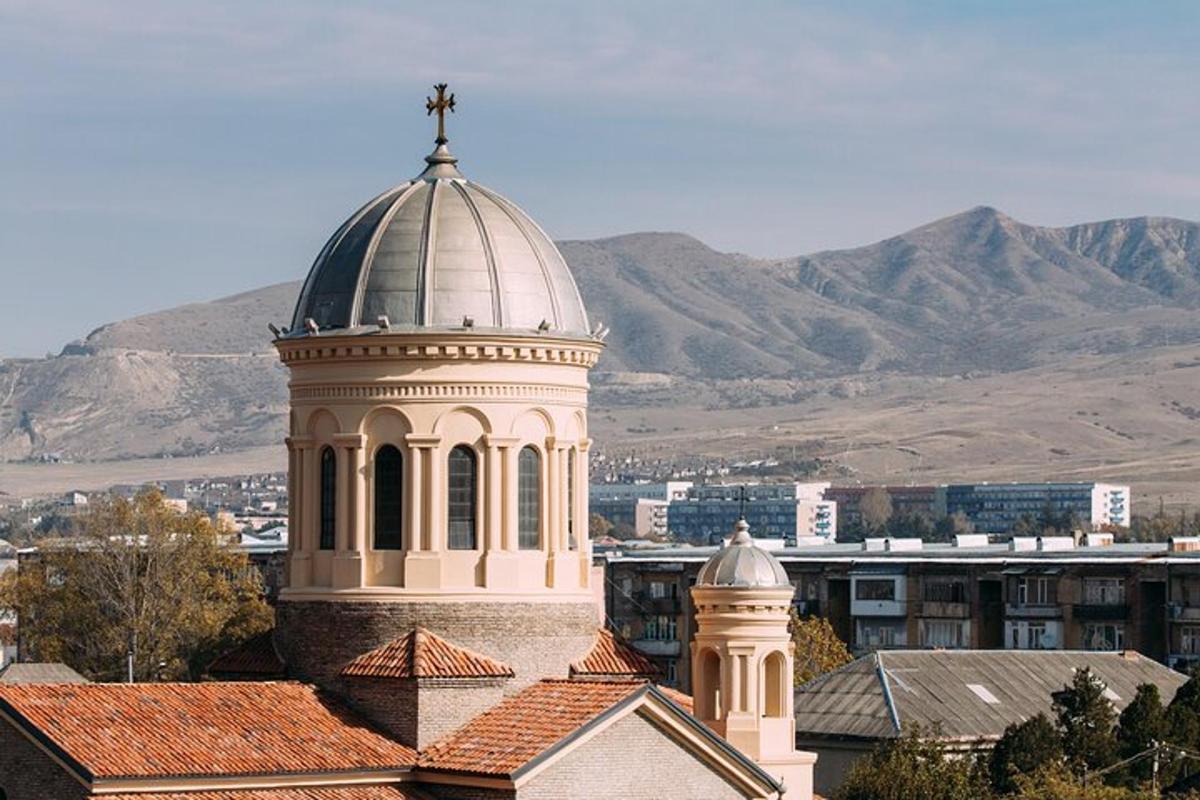 a building with a tower with a cross on top of it