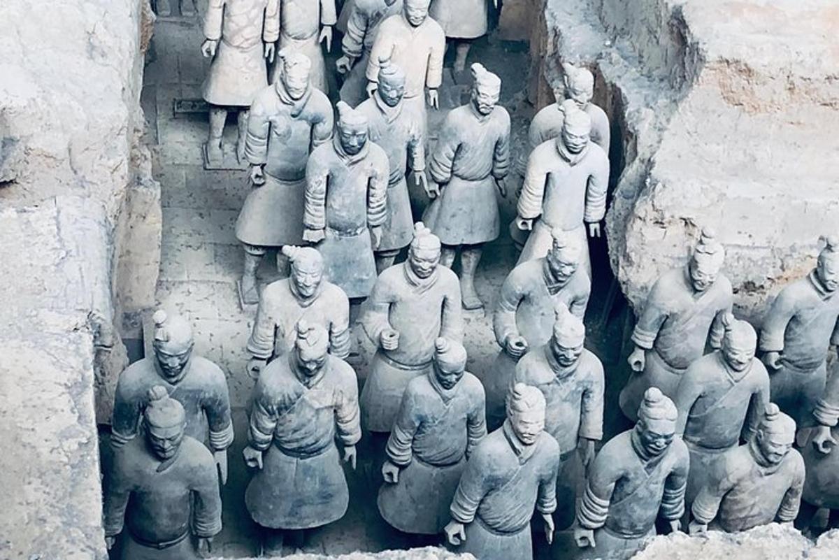 an old photo of a group of statues