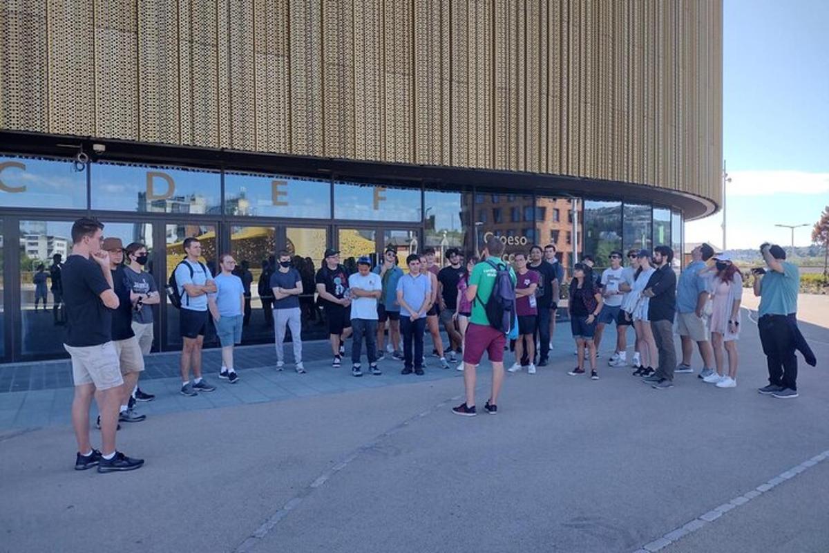 a group of people standing outside of a building