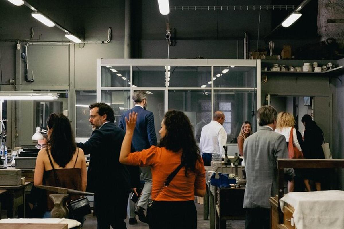 a group of people standing in a kitchen