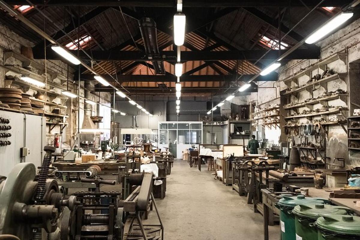 a large room with tables and chairs in a factory