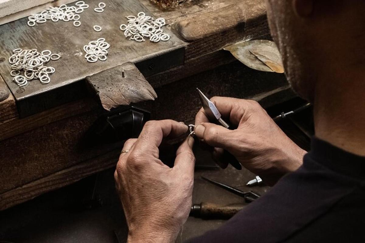 a man is cutting a piece of art on a table