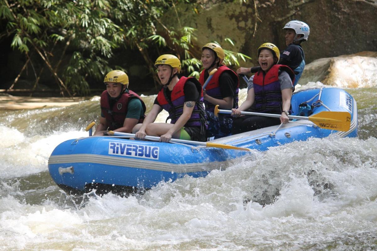 a group of people in a raft on a river
