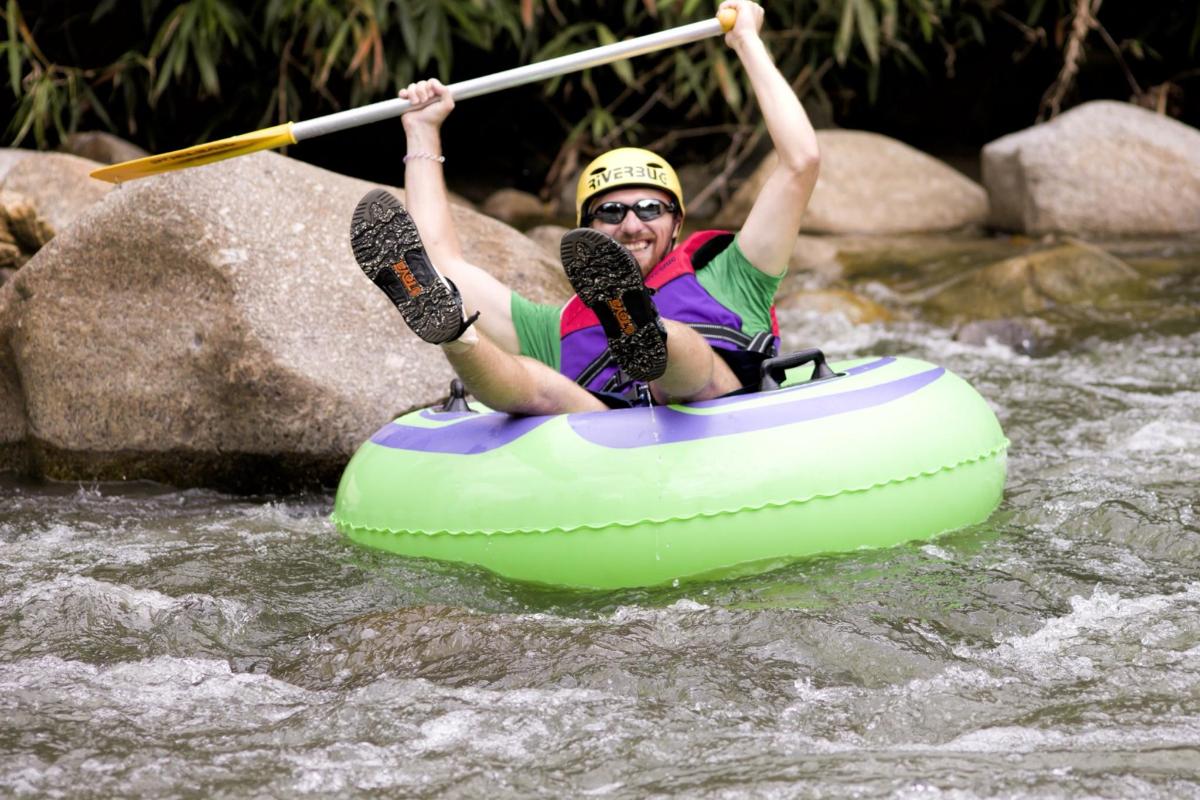 a man is in a raft in the water