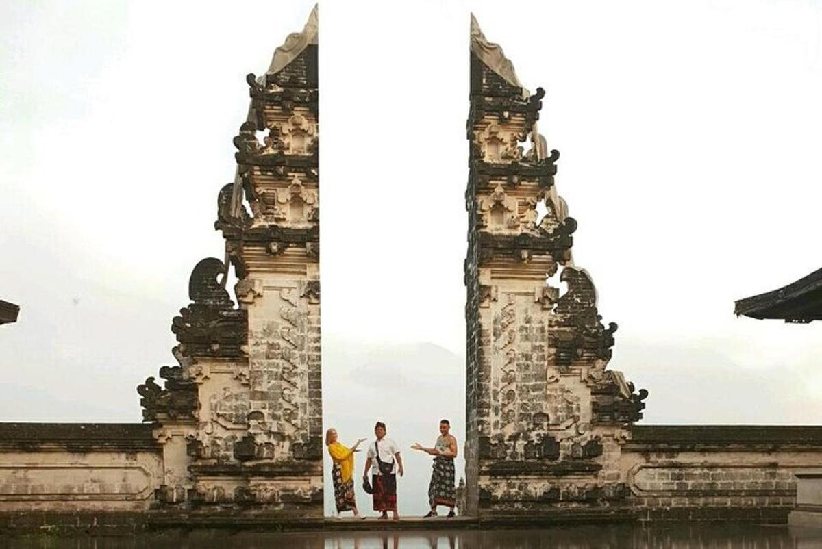 a group of people standing in front of a monument