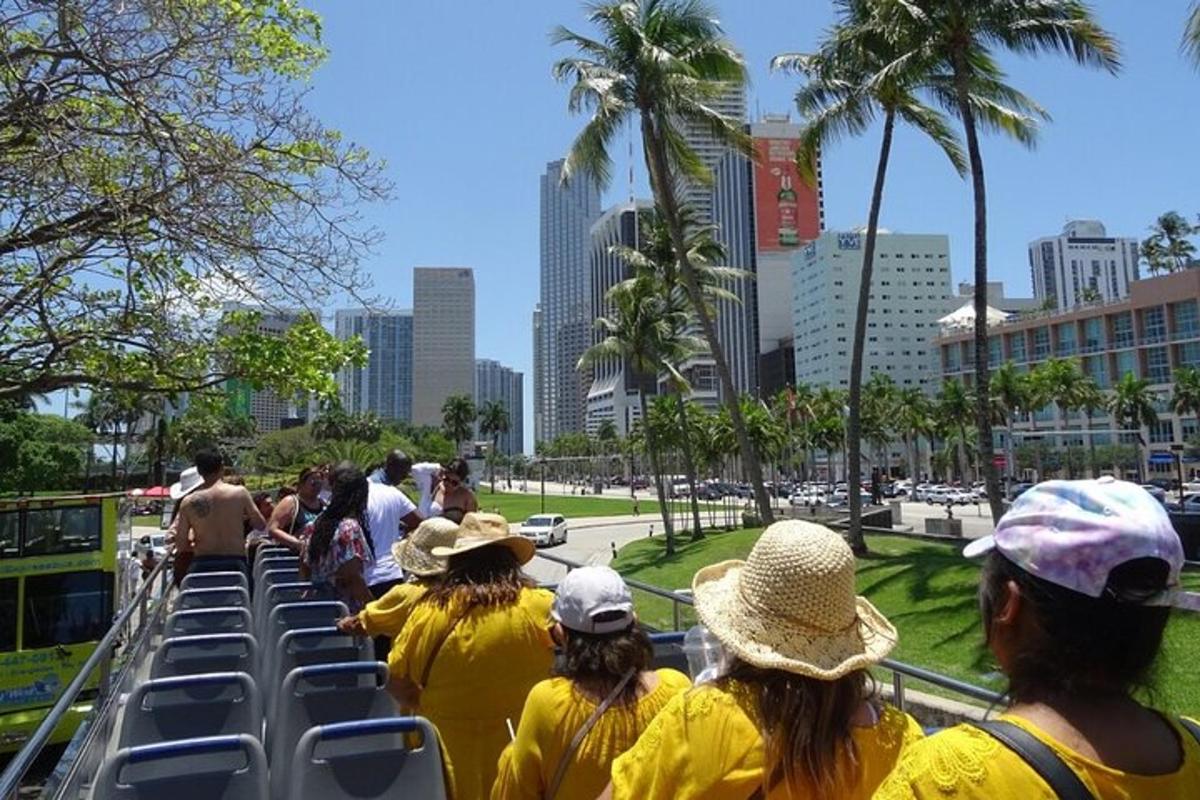 a group of people in yellow shirts on a bus