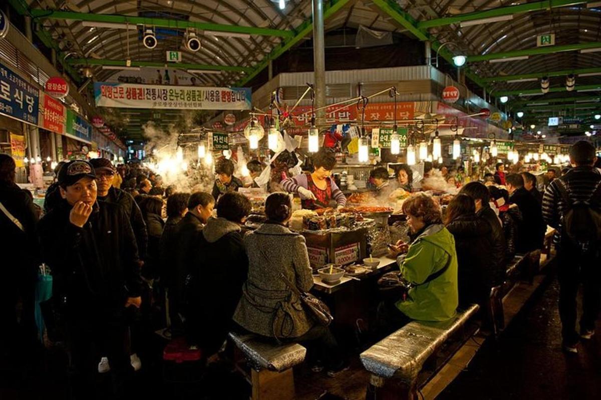 a group of people standing in a market