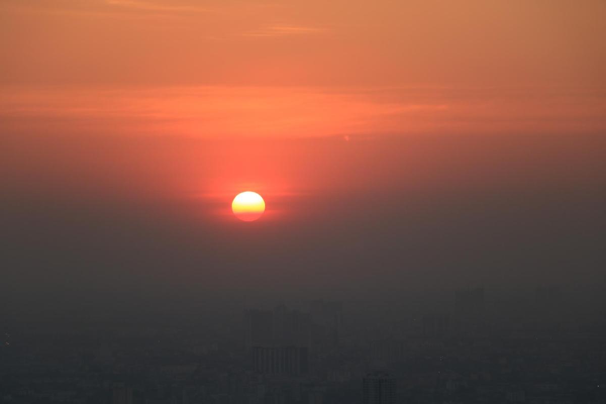 a sunset with the sun in the sky