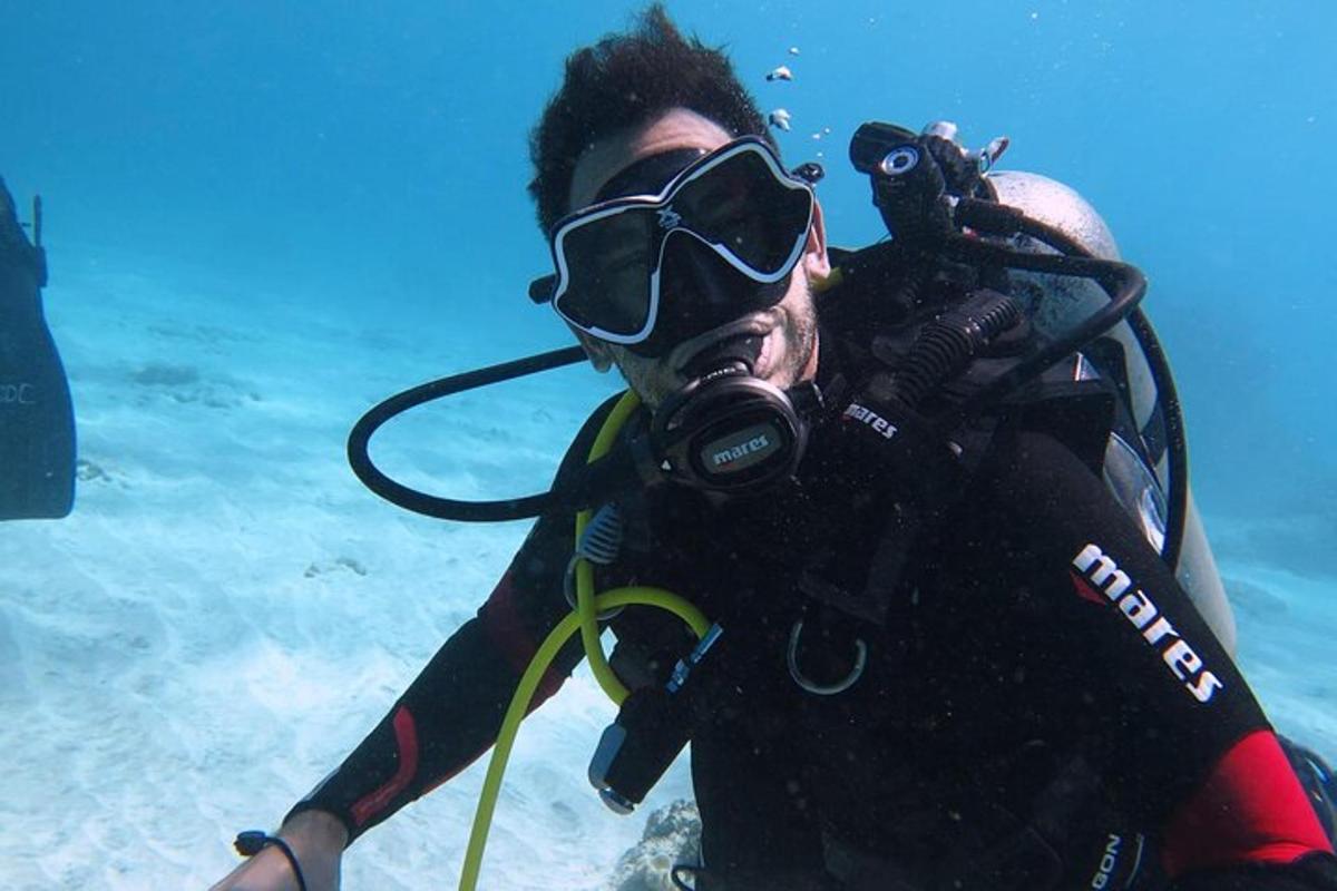 a man in the water wearing a diving mask