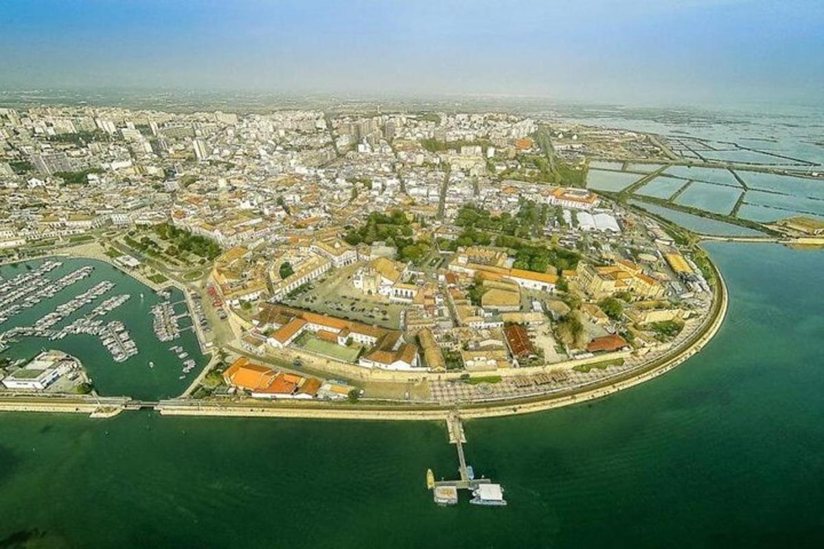 an aerial view of a city in the water