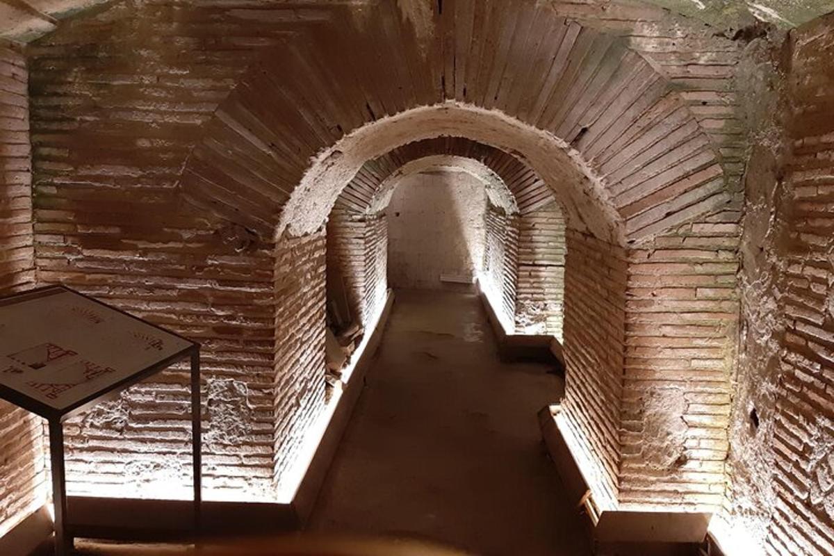 an empty hallway in an old brick building