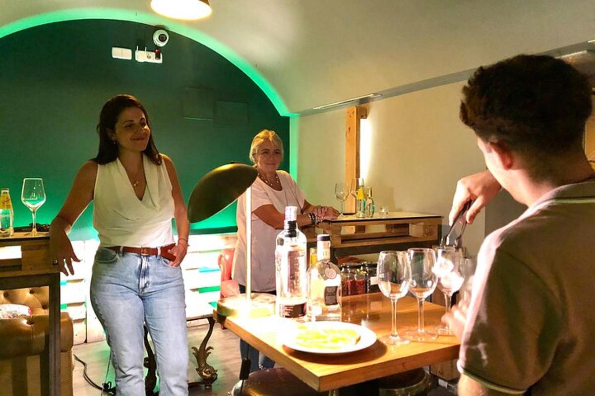 a group of people standing around a table with wine glasses