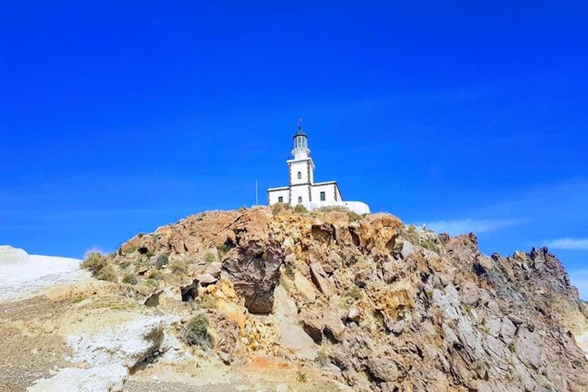 a lighthouse on the top of a mountain