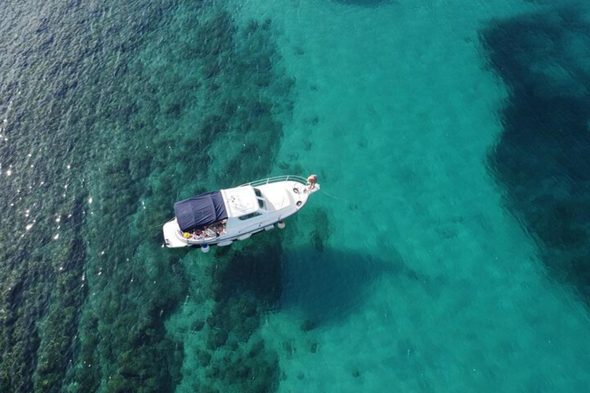 an aerial view of a boat in the water