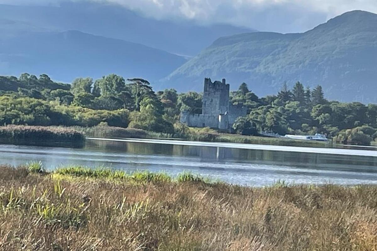a castle sitting on the side of a river