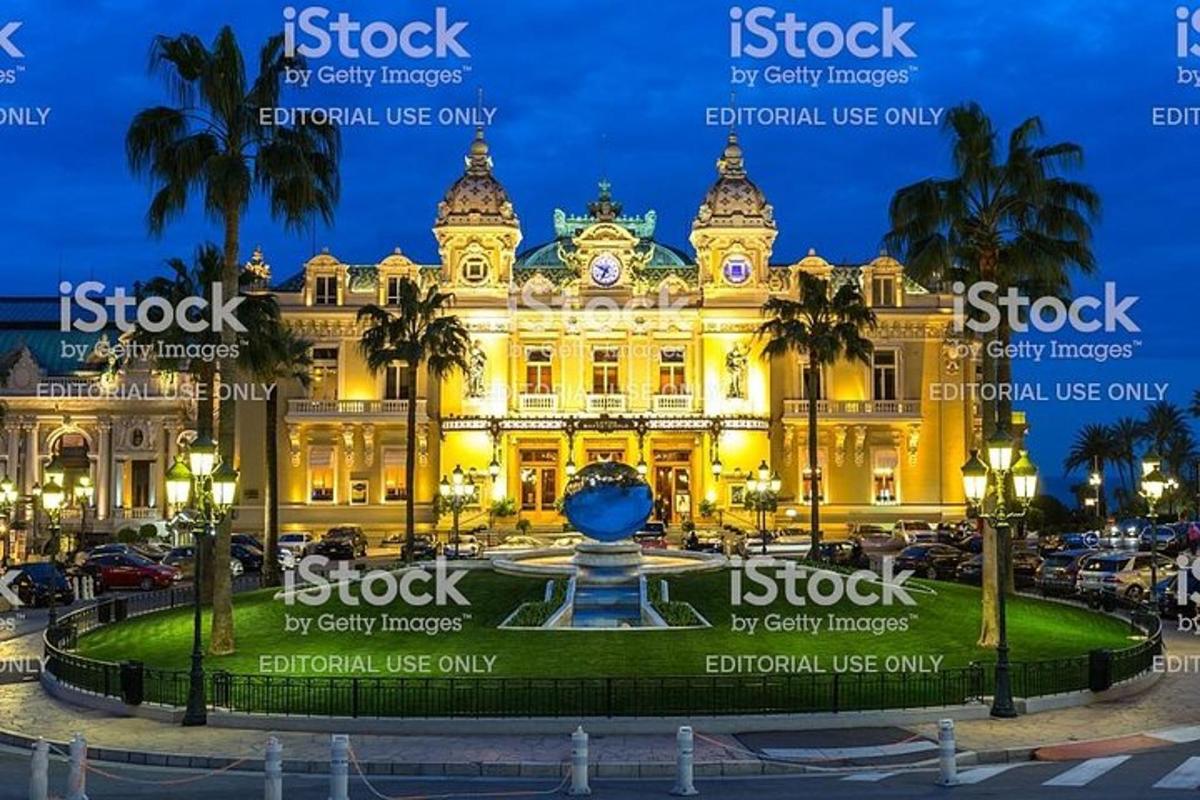 a building with a fountain in front of it at night