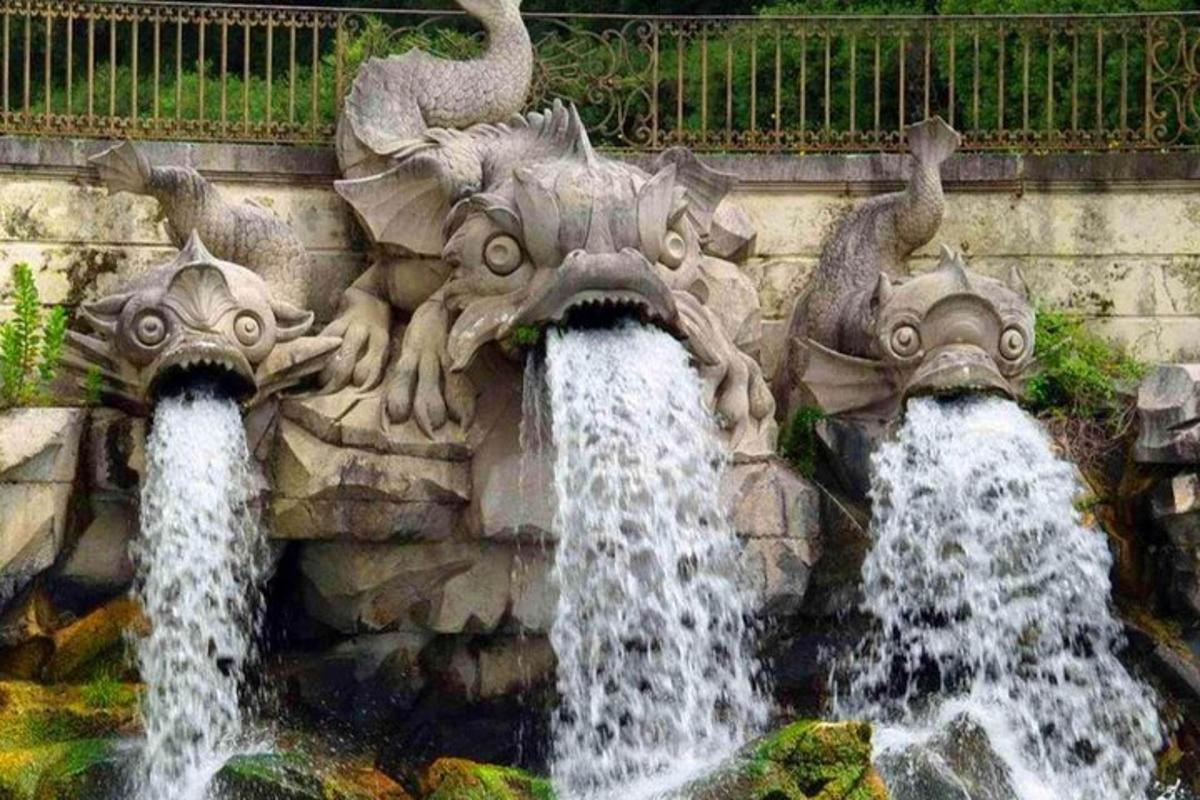 two water fountains on the side of a wall