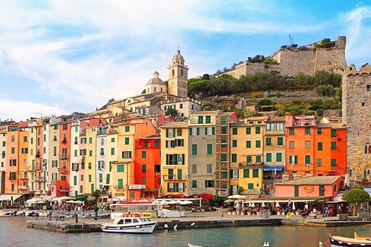 a group of colorful buildings next to a body of water